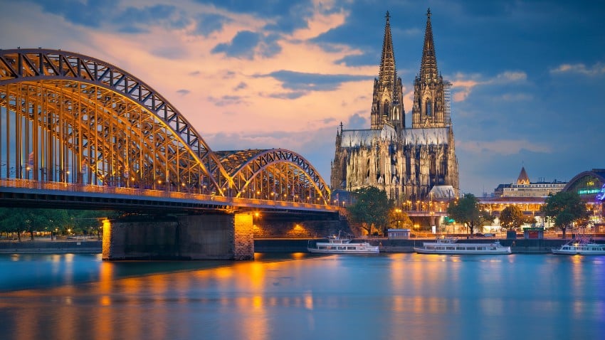 Cologne Cathedral and Hohenzollern bridge across the Rhine River, Germany