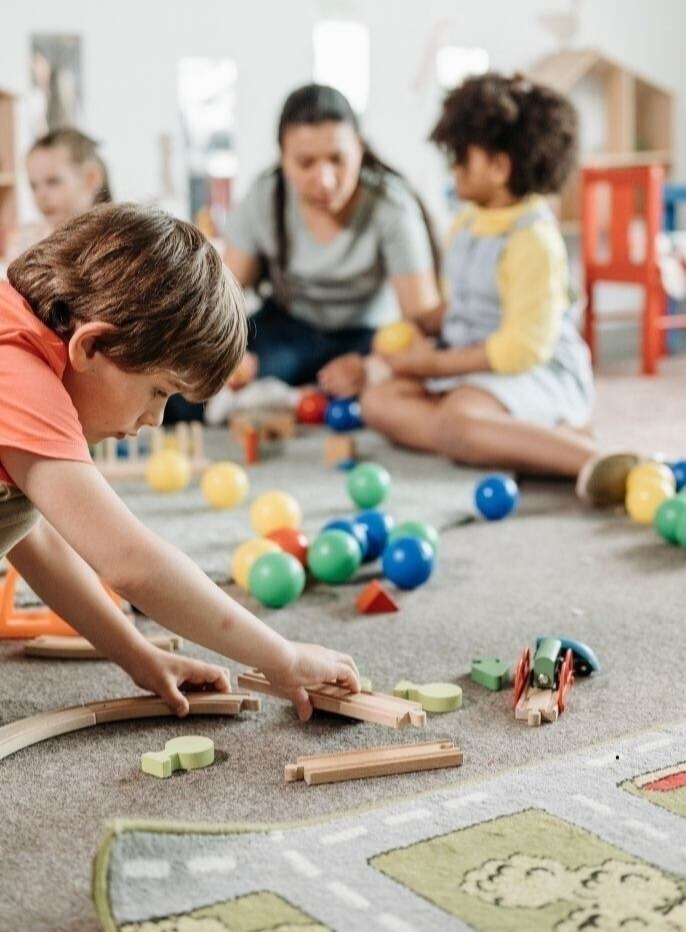 Children playing with wooden toys