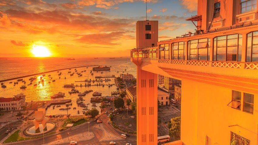 In Salvador, indulge in treats much appreciated in Brazil, like freshly fried acarajé, as you stroll along the bustling Porto da Barra. It’s the perfect spot to enjoy a stunning sunset over the bay