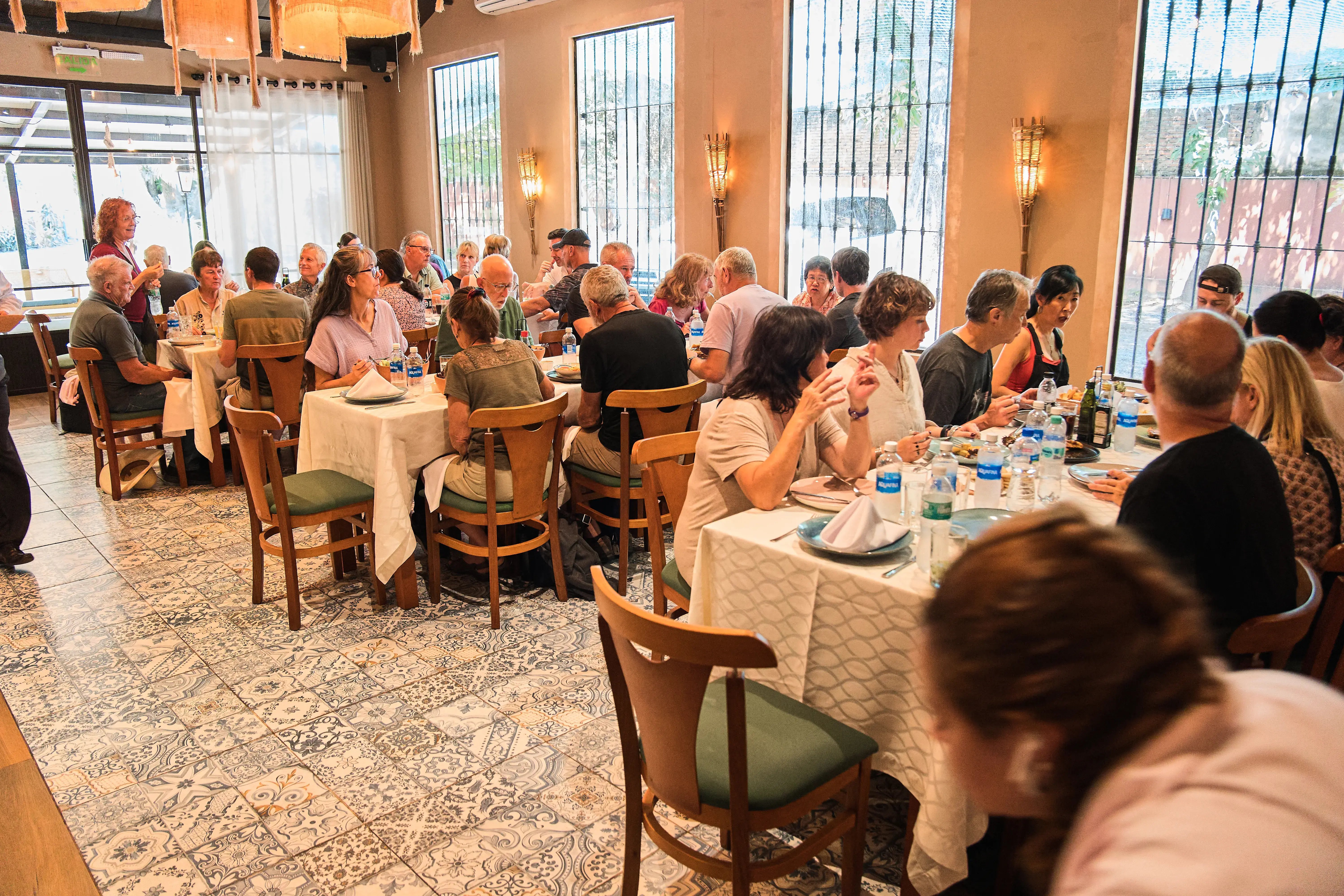 Group of people at a restaurant during the Paraguay tour — September 2025