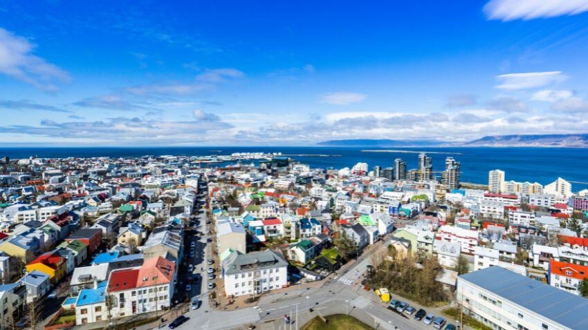 Reykjavik’s remote location and reliance on imports drive high living costs. Many young residents seek opportunities abroad as expenses and taxes consume much of their income, despite its natural beauty