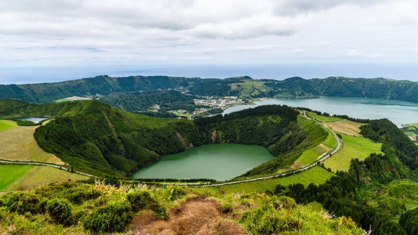 The Azores’ remote location makes them one of the best places to visit in Portugal for untouched natural landscapes. São Miguel is the largest and most visited island. The Sete Cidades crater lake, split into green and blue halves, is one of the most striking natural wonders in all of Portugal