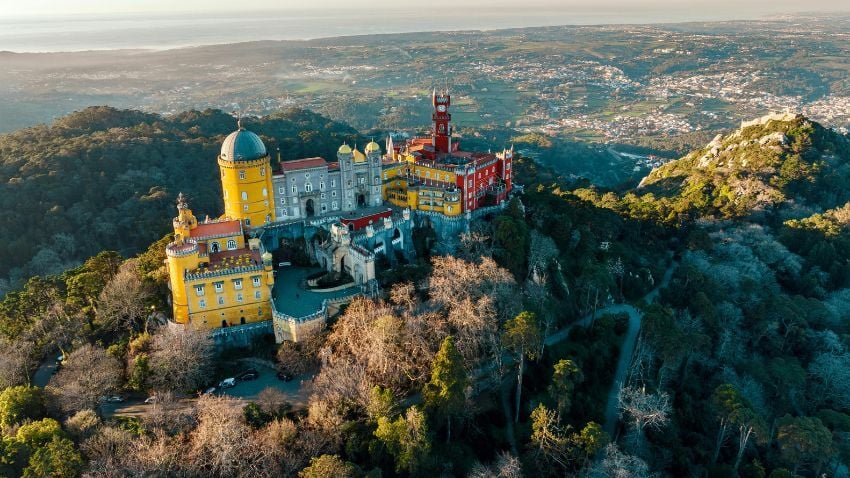 Pena Palace, in Sintra, stands out as one of the best places to see in Portugal for its colourful and unique architecture&nbsp;. Sintra is a small town in the forested hills about thirty minutes by train from Lisbon. It makes you reconsider what you thought you knew about Portugal or Europe in general