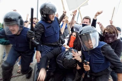 Police officers fighting against the people