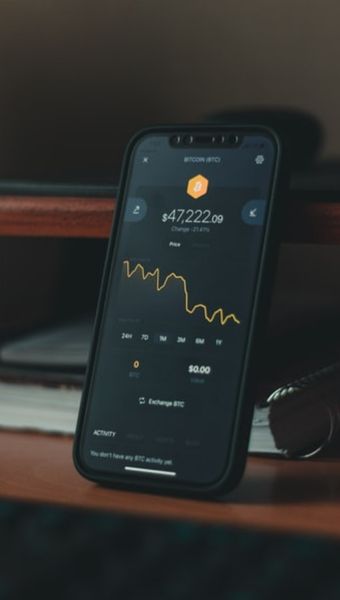 smartphone with bitcoin graph