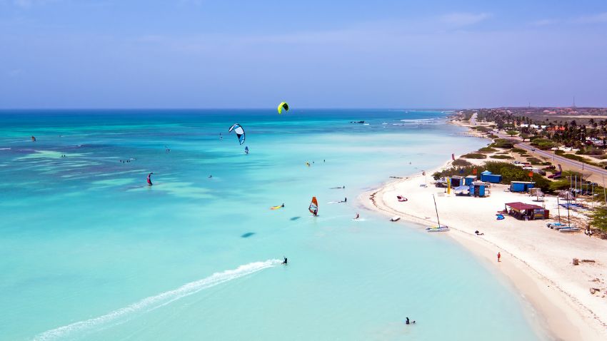 Aerial from kite surfing on Aruba island - This Caribbean paradise is renowned for its stunning natural beauty, and the visa program offers several advantages to those looking to make the most of their remote work lifestyle.