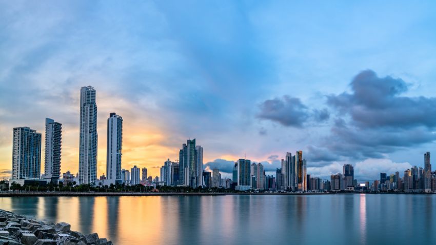 Buildings reflecting in the water in Panama City